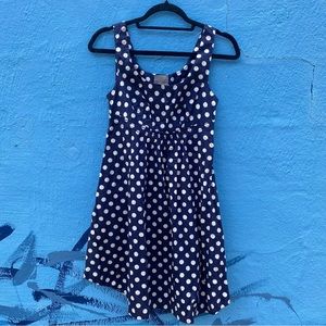 Sleeveless blue and white polka dot mini dress with pockets, size small